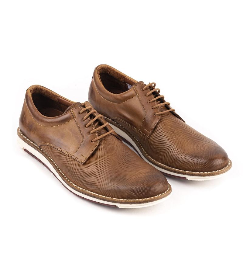 Zapatos de vestir en cuero picado suela