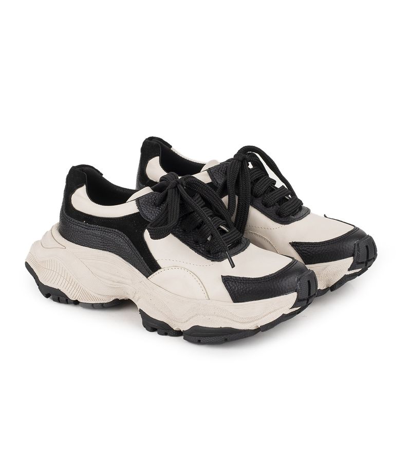 Zapatilla de cuero estilo chunky en negro y natural